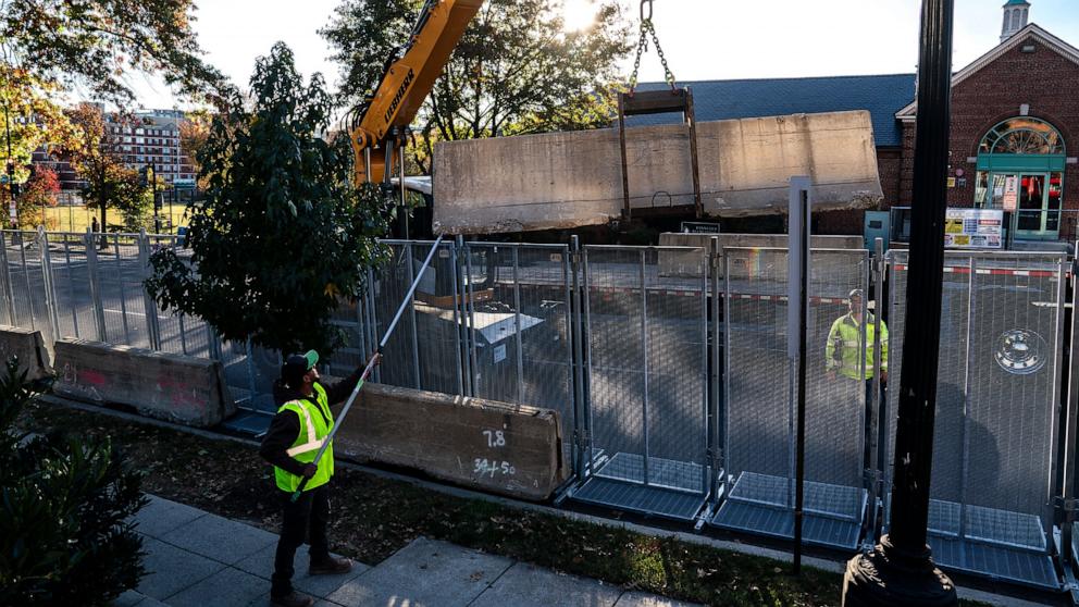 PHOTO: Workers erect anti-scale fencing and other security measures around Howard University, Nov. 3, 2024, in Washington.