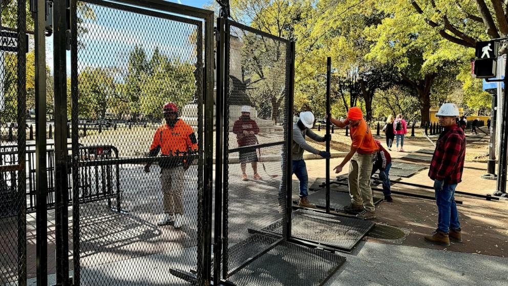 PHOTO: Security fencing is assembled around Lafayette Square as construction for the presidential inauguration parade takes place near the White House in Washington, Nov. 3, 2024. 