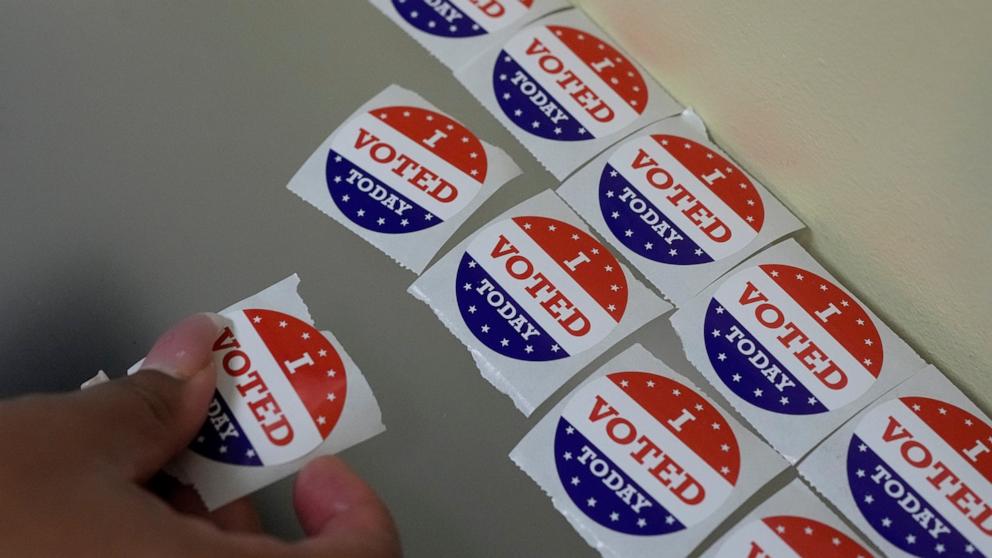 PHOTO: A person picks up an "I Voted Today" sticker after casting their ballot during early in-person voting, Oct. 30, 2024, in Nashville, Tenn. 