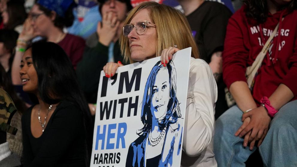 PHOTO: A supporter of Democratic presidential nominee U.S. Vice President Kamala Harris holds a sign during a campaign rally at Muhlenberg College in Allentown, Pa., Nov. 4, 2024.