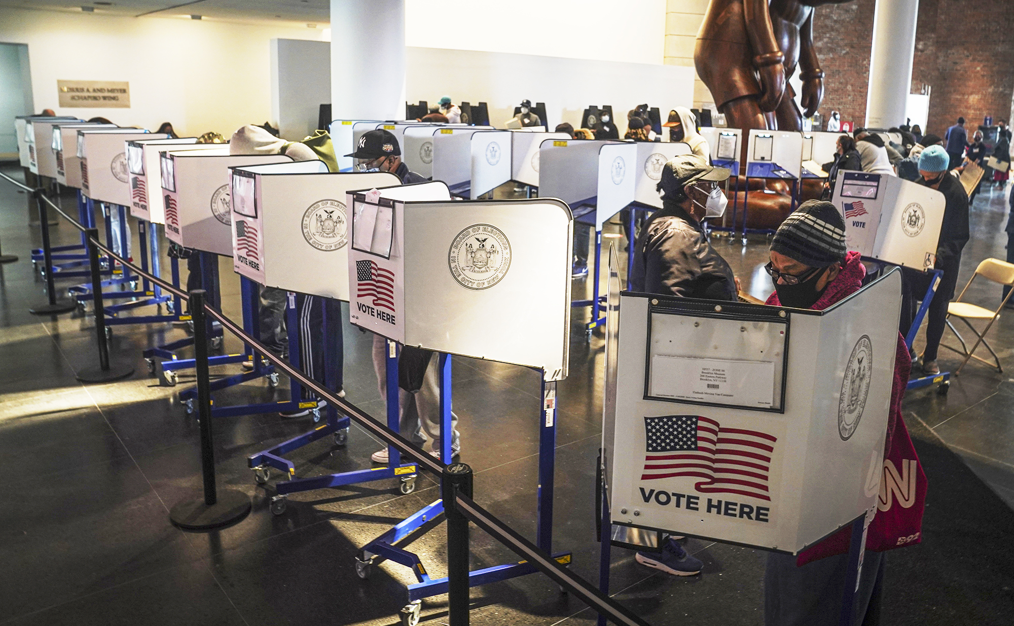 PHOTO: Voters cast their ballots at privacy booths during early voting at the Brooklyn Museum in New York, Oct. 27, 2020.