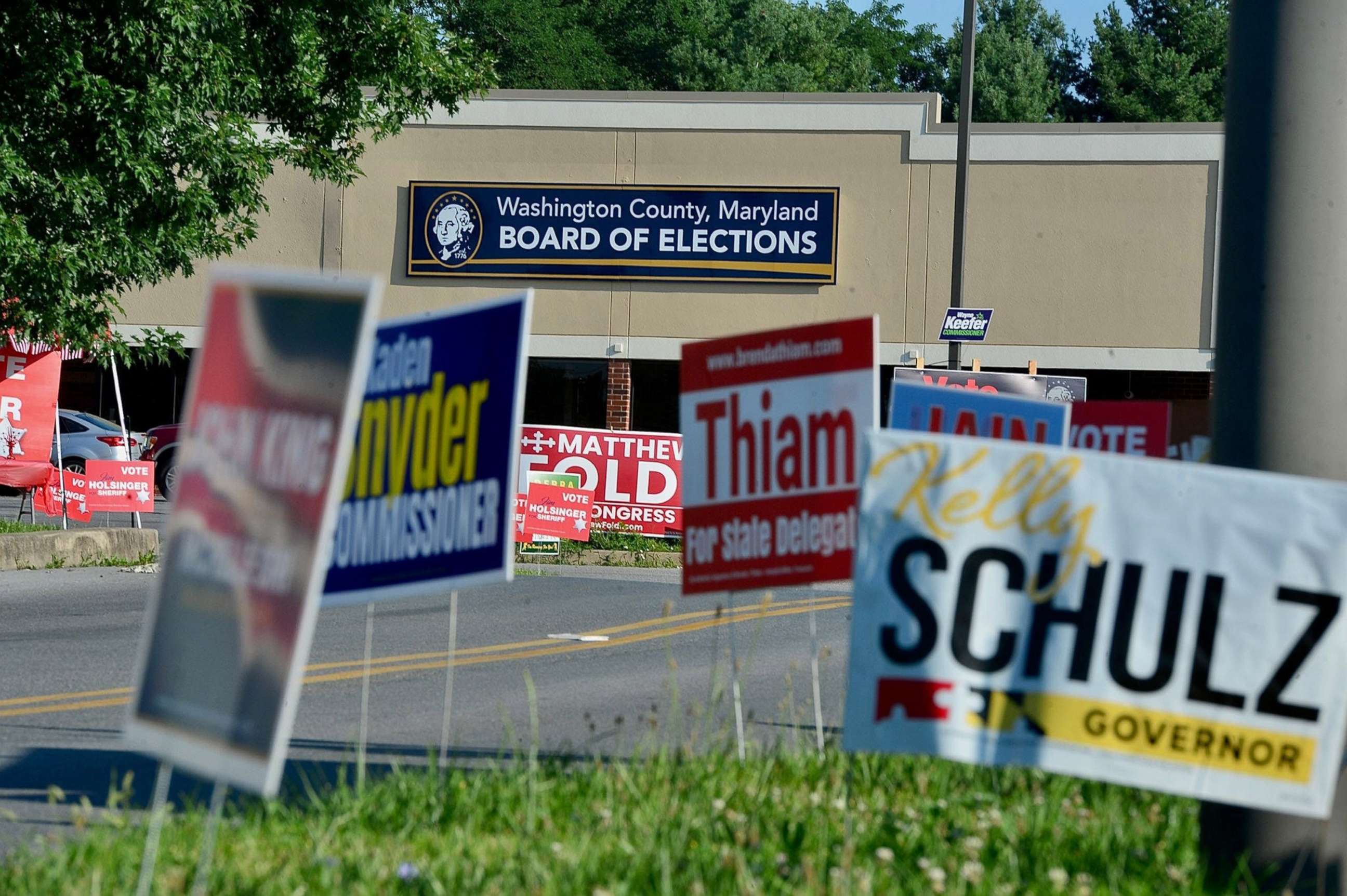 PHOTO: Campaign signs stand along the entrance to the polling place at the Washington County Board of Elections in Hagerstown Md., July 19, 2022.