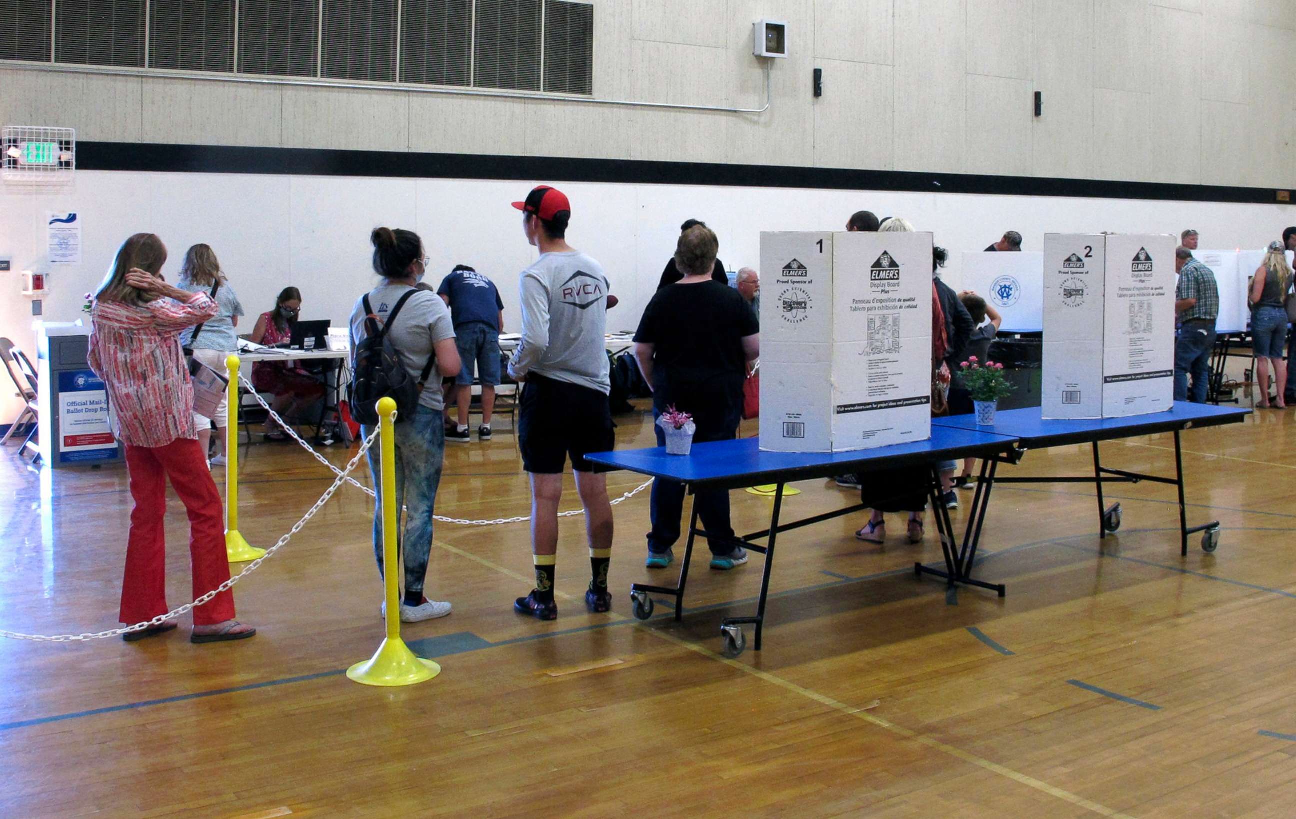 PHOTO: Washoe County voters line up to cast their primary election ballots inside a gymnasium at Reed High School in Sparks, Nevada, June 14, 2022. 