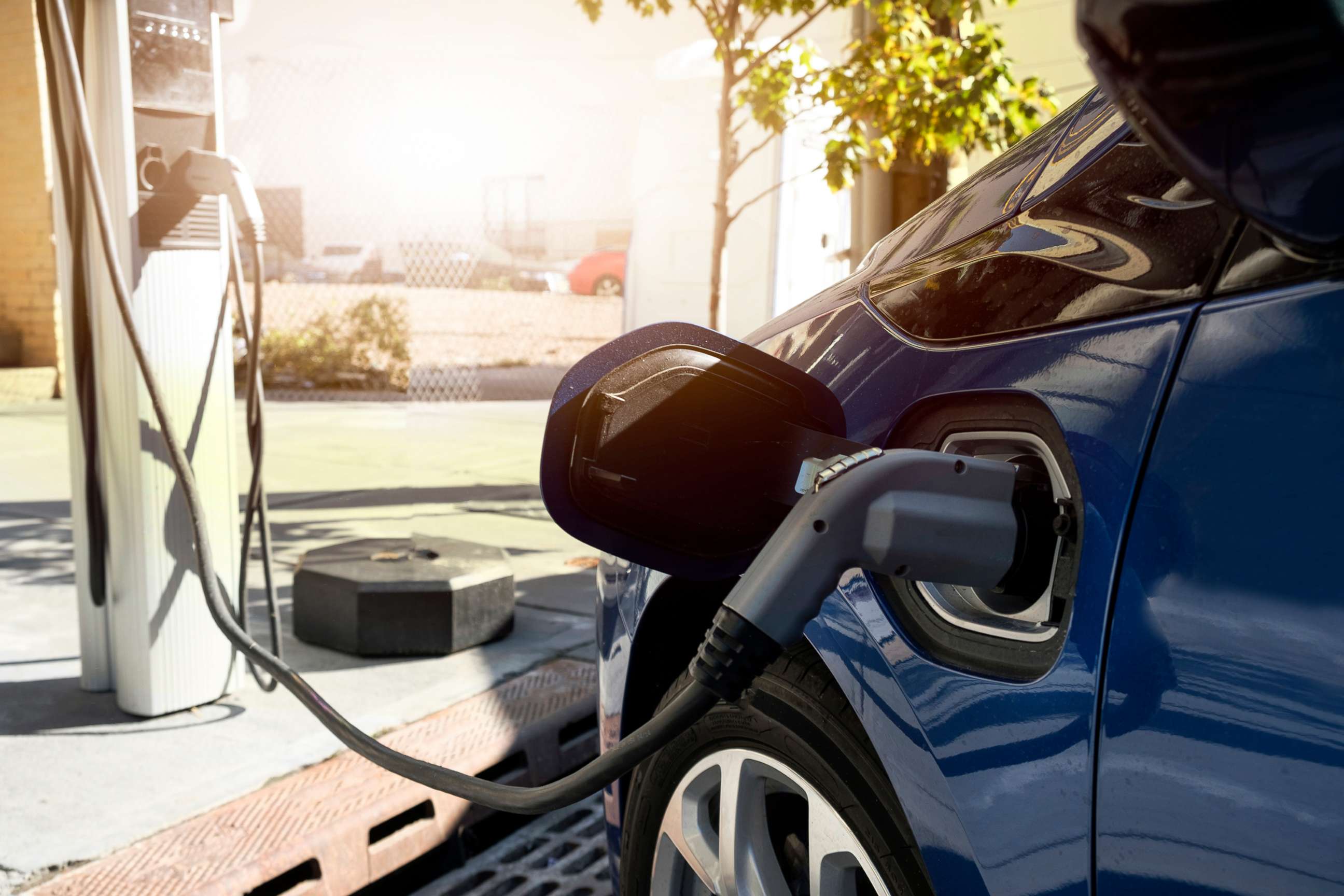 PHOTO: A car charges at an electric car recharging station.