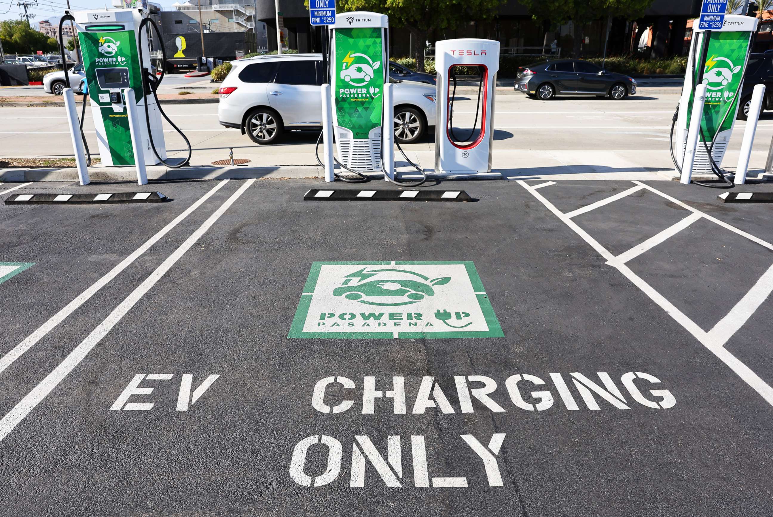 PHOTO: An 'EV Charging Only' sign is seen at a Power Up fast charger station for electric vehicles on April 14, 2022, in Pasadena, Calif. 