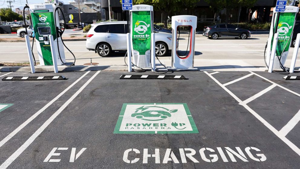 PHOTO: An 'EV Charging Only' sign is seen at a Power Up fast charger station for electric vehicles on April 14, 2022, in Pasadena, Calif. 