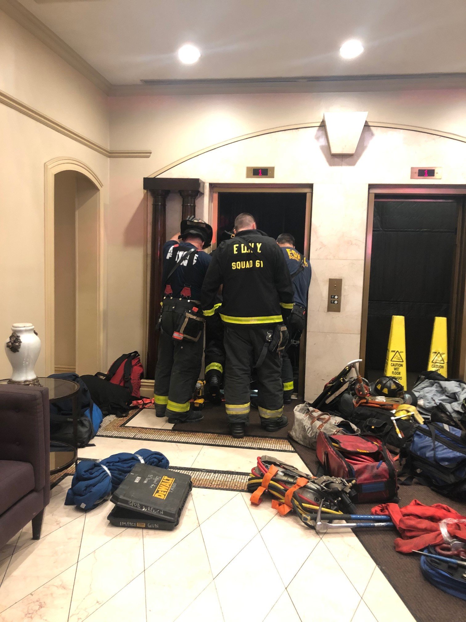 PHOTO: New York Fire Department members investigate an incident with an elevator in an apartment building in New York city.