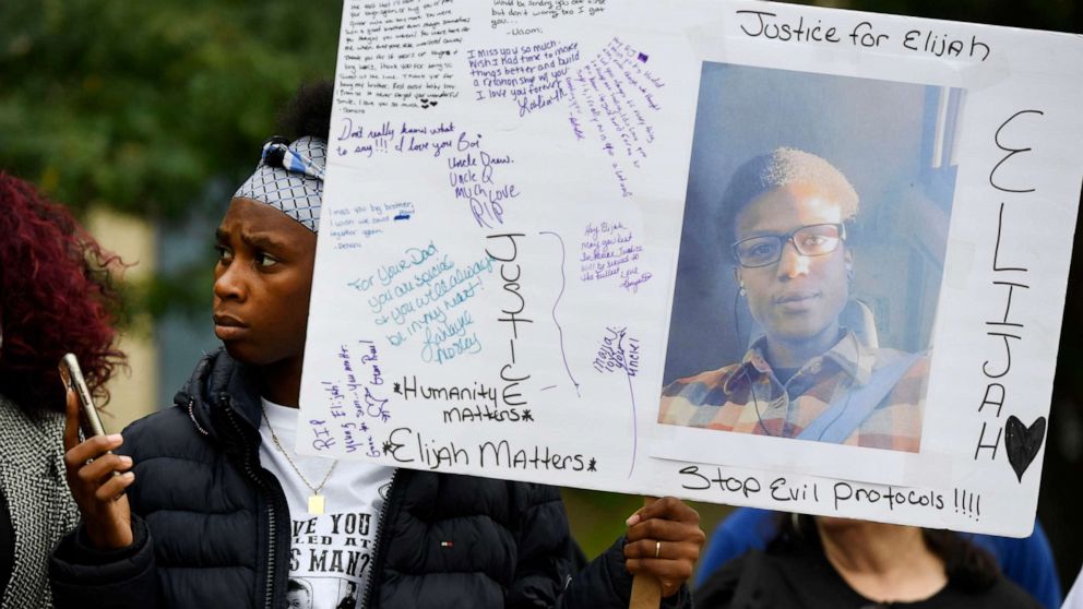 PHOTO: Rashiaa Veal holds a sign of her cousin, Elijah McClain at a press conference in front of the Aurora Municipal Center, Oct.1, 2019. 