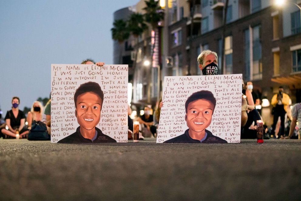 PHOTO: People gather at a candlelight vigil to demand justice for Elijah McClain on the one year anniversary of his death at The Laugh Factory on Aug. 24, 2020 in West Hollywood, Calif.