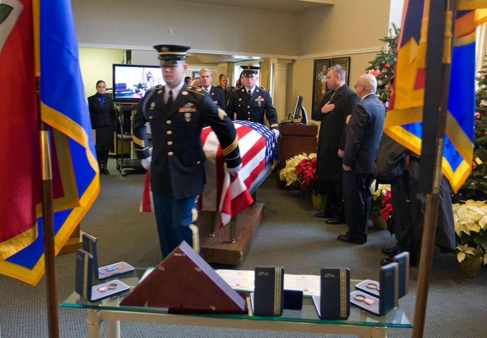 PHOTO: An honor guard escorts the flag-draped casket of U.S. Army Sgt. Elijah John-Miles Rao, 26, to a funeral service, Dec. 15, 2009, in Portland, Ore.