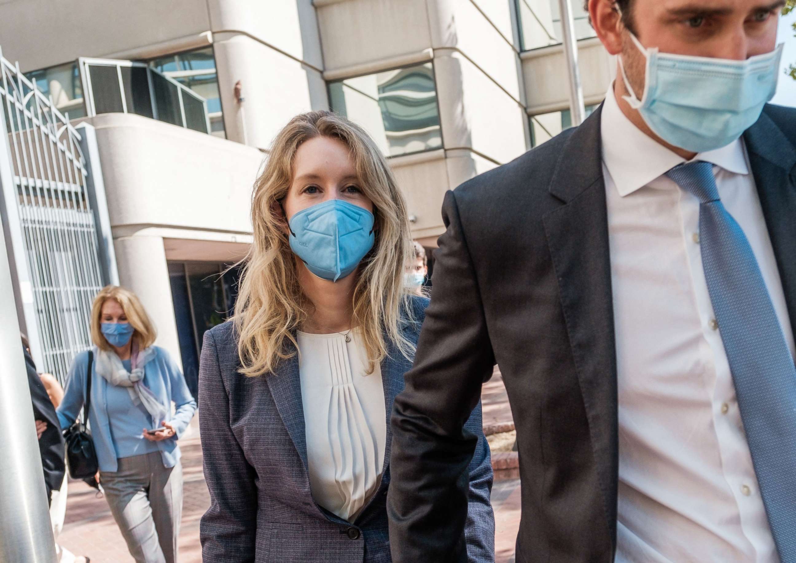 PHOTO: Elizabeth Holmes, founder and former CEO of Theranos, leaves the courthouse with her husband, Billy Evans after the first day of her fraud trial in San Jose, Calif., Sept. 8, 2021.