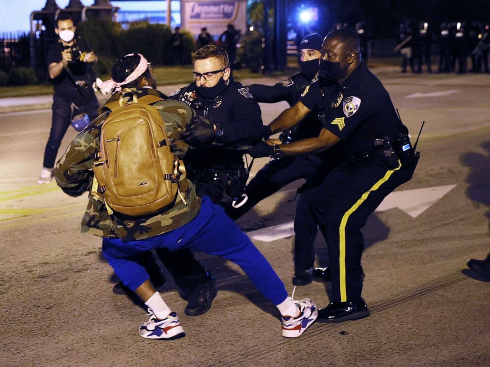 PHOTO: Law enforcement officials arrest a person as they protest the killing of Andrew Brown Jr., April 28, 2021, in Elizabeth City, N.C.