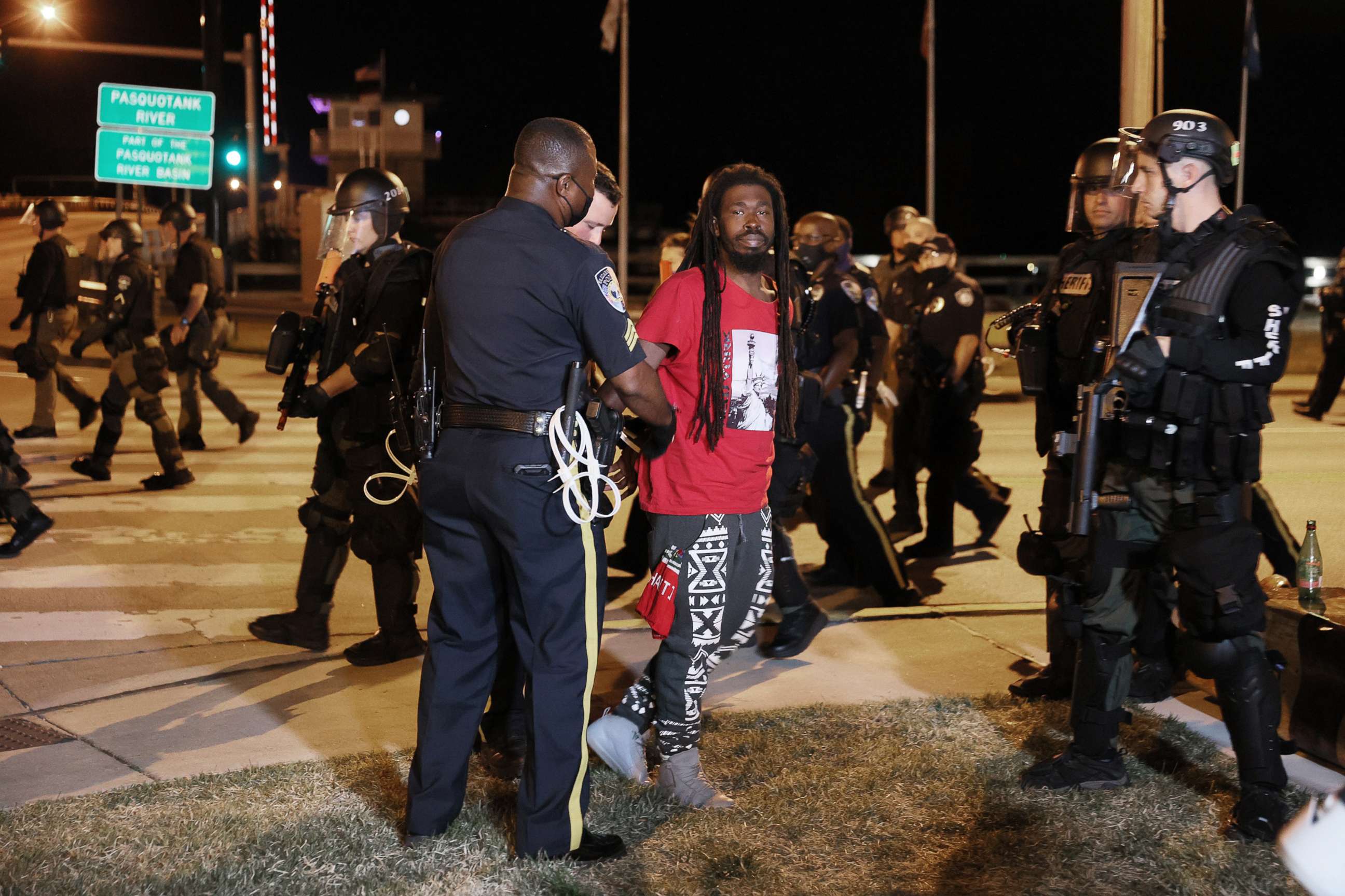 PHOTO: Law enforcement officials arrest a person as they protest the killing of Andrew Brown Jr., April 28, 2021, in Elizabeth City, N.C. 