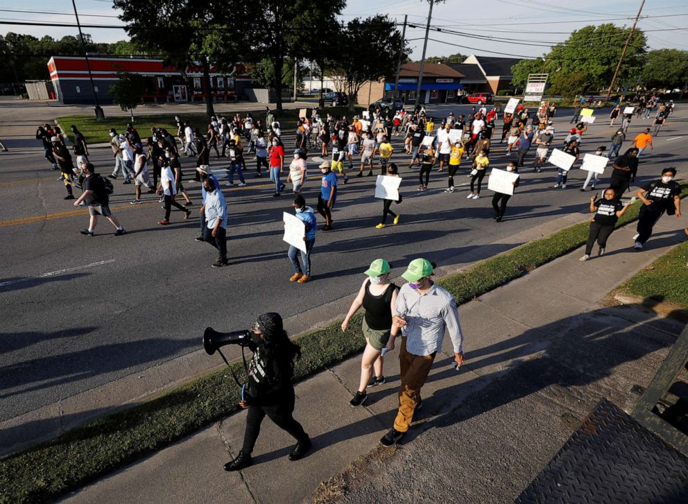PHOTO: A group of protesters march through the city a week after Andrew Brown Jr. was killed by sheriff's deputies in Elizabeth City, N.C., April 28, 2021.