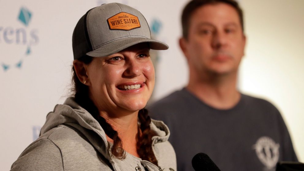 Ellie Hayes, the mother of Keane Webre-Hayes, reacts as she speaks about her son's recovery, alongside her husband, Ben, right, at a hospital Monday, Oct. 1, 2018, in San Diego. 