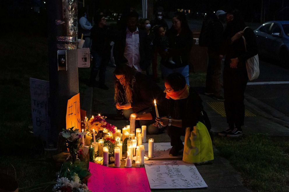 PHOTO: People light candles during a vigil for Manuel Ellis, a black man whose March death while in Tacoma Police custody was recently found to be a homicide.