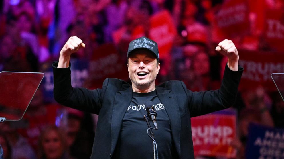 PHOTO: Tesla and SpaceX CEO Elon Musk gestures as he steps on stage during a rally for former President and Republican presidential candidate Donald Trump at Madison Square Garden in New York City, Oct. 27, 2024.