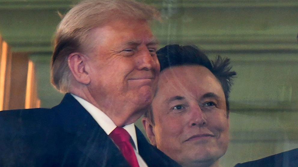 PHOTO: President-elect Donald Trump stands with Elon Musk as they attend the NCAA college football game between Army and Navy at Northwest Stadium in Landover, Md., Dec. 14, 2024.