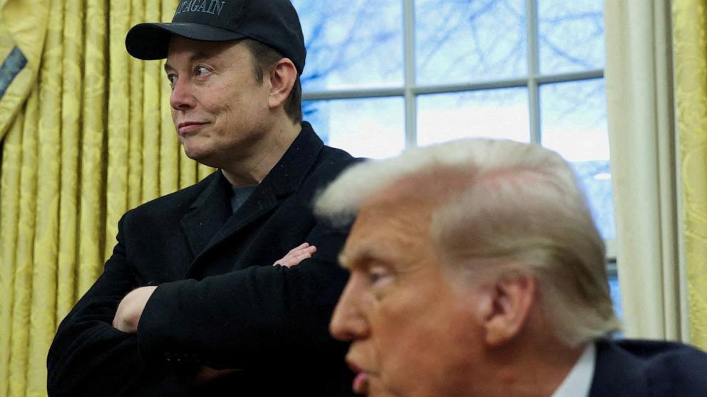 PHOTO: Elon Musk listens to President Donald Trump speak in the Oval Office of the White House in Washington, Feb. 11, 2025.