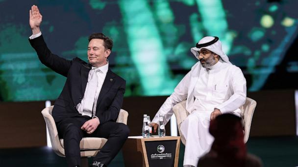 Tesla CEO Elon Musk sits with Saudi Minister of Communications and Information Technology Abdullah Al-Swaha, at the Saudi-U.S. Investment Forum, in Riyadh, Saudi Arabia, May 13, 2025. 