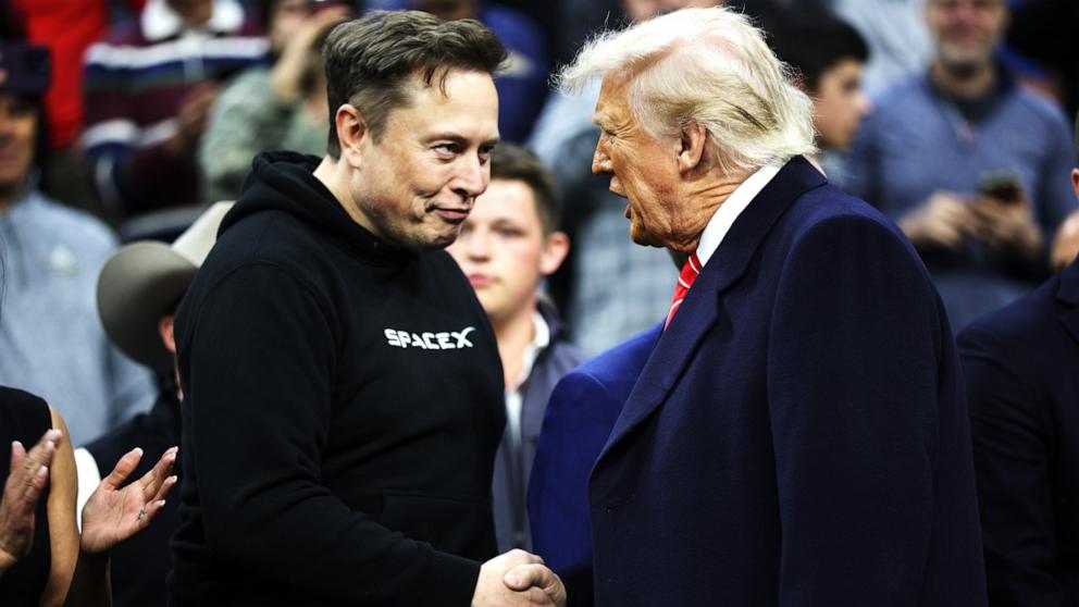 PHOTO: President Donald Trump and White House Senior Advisor, Tesla and SpaceX CEO Elon Musk shake hands while attending the NCAA Division 1 Wrestling Championship, Mar. 22, 2025 in Philadelphia.
