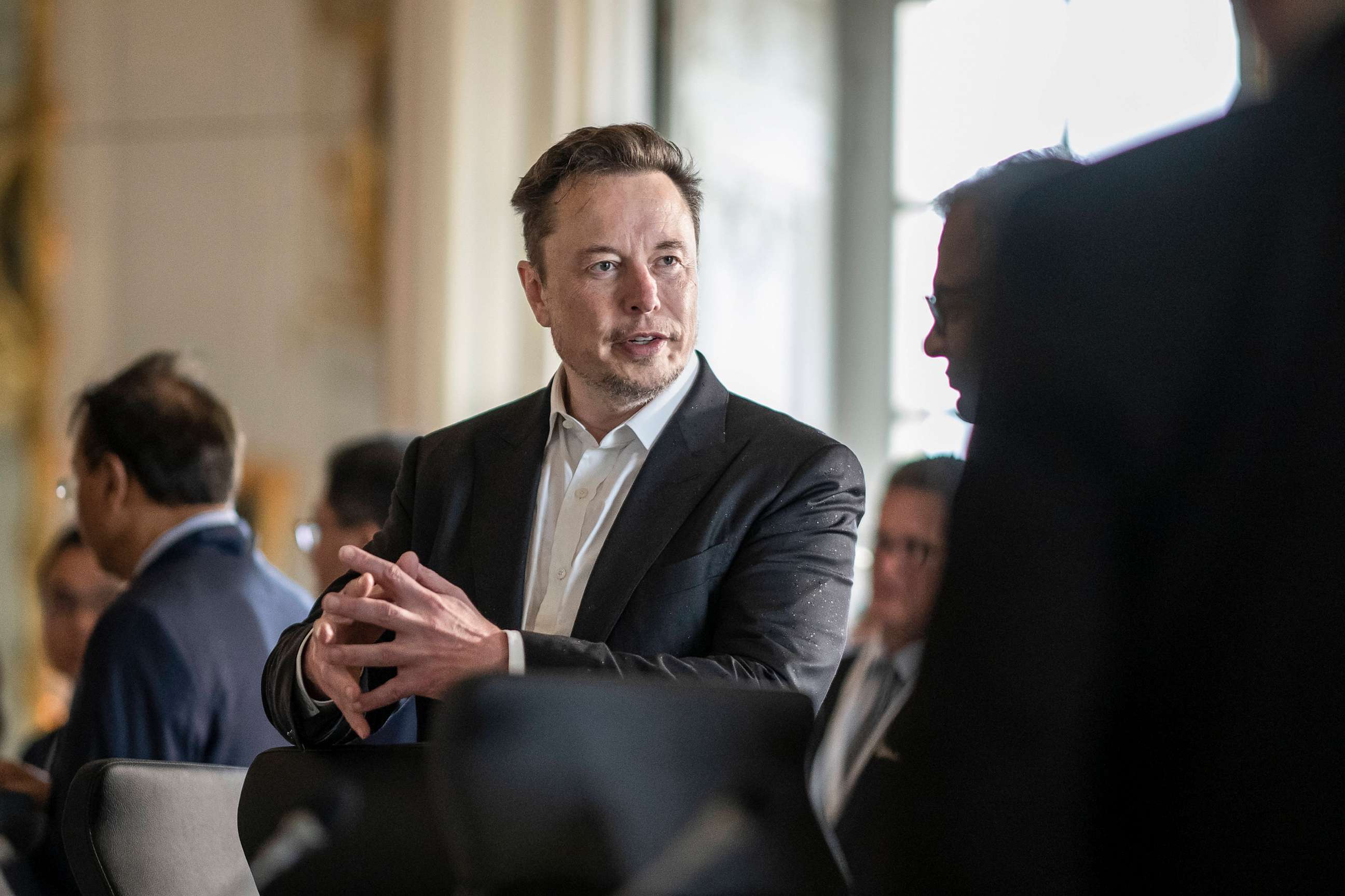PHOTO: SpaceX, Twitter and electric car maker Tesla CEO Elon Musk at the 6th edition of the "Choose France" Summit at the Chateau de Versailles, outside Paris on May 15, 2023.