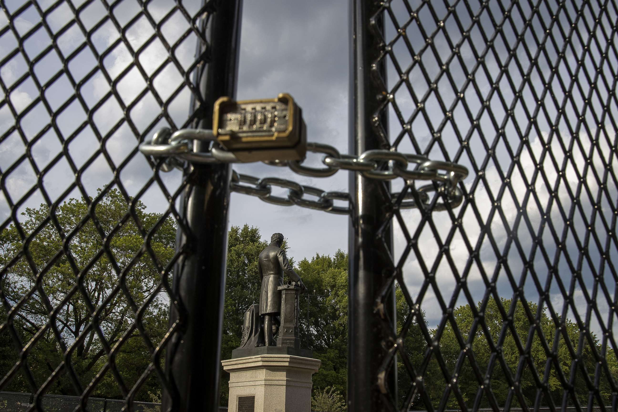 PHOTO: *A locked gate surrounds the Emancipation Memorial debate in Lincoln Park, June 26, 2020, in Washington, D.C., to protect it as controversy and protests erupted around monuments that many find offensive.