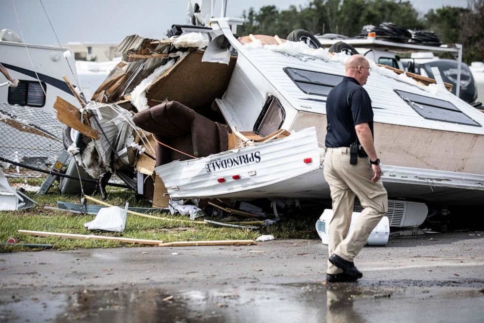 PHOTO: Bill Bailey, assistant chief of the Emerald Isle Police Department, walks past a damaged trailer in the Holiday Trav-l Park, Sept. 5, 2019, in Emerald Isle, N.C, after a possible tornado generated by Hurricane Dorian struck the area.
