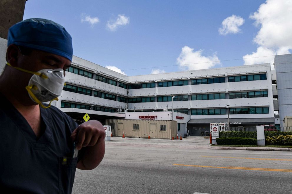 PHOTO: A medic walks outside of Emergency at Coral Gables Hospital where coronavirus patients are treated in Coral Gables near Miami, Florida, on July 30, 2020.