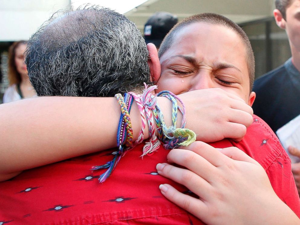 PHOTO: Marjory Stoneman Douglas High School student Emma Gonzalez hugs her father Jose after speaking at a rally for gun control at the Broward County Federal Courthouse in Fort Lauderdale, Fla., Feb. 17, 2018.