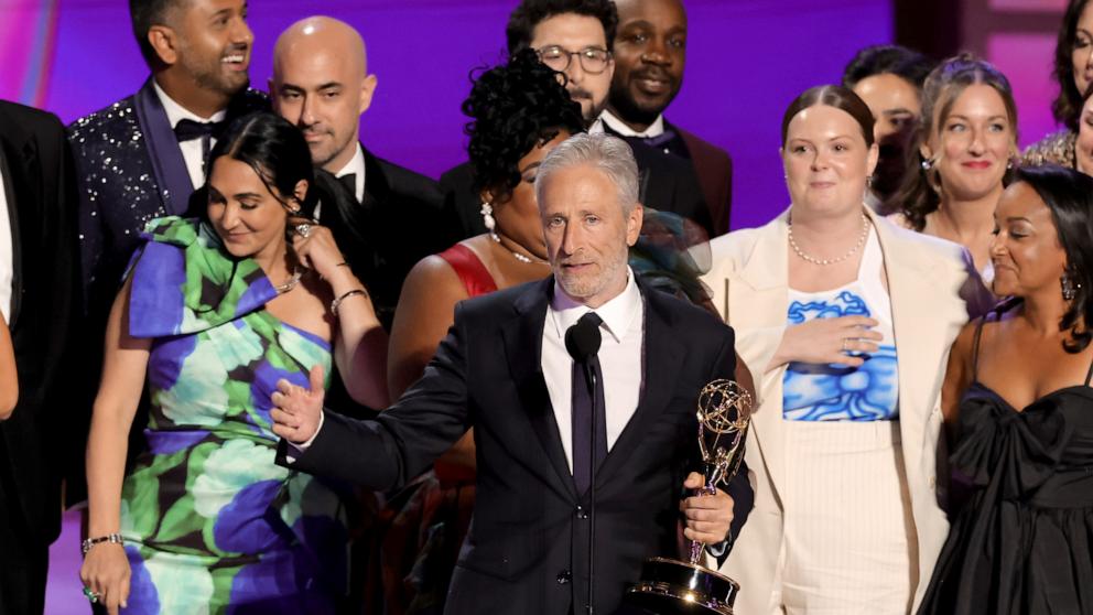 PHOTO: Jon Stewart (C), cast, and crew accept the Outstanding Talk Series award for The Daily Show onstage during the 76th Primetime Emmy Awards, Sept. 15, 2024, in Los Angeles.