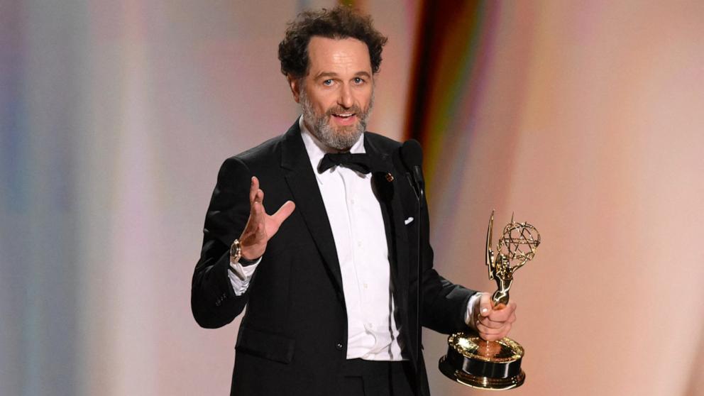 PHOTO: Welsh actor Matthew Rhys accepts the award for Outstanding Lead Actor in a Comedy Series for "Widow's Bay" onstage during the 78th Primetime Emmy Awards, in Los Angeles, September 14, 2026.