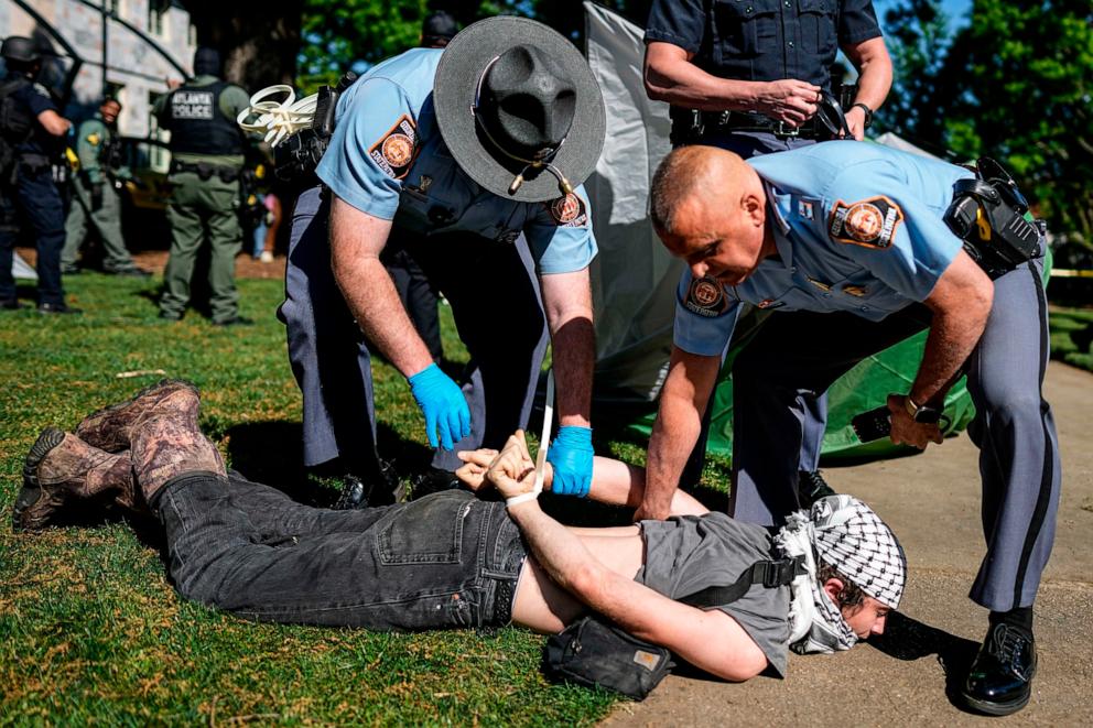 PHOTO: Georgia State Patrol officers detain a protester on the campus of Emory University during an Israel Palestinian demonstration, Thursday, April 25, 2024, in Atlanta.