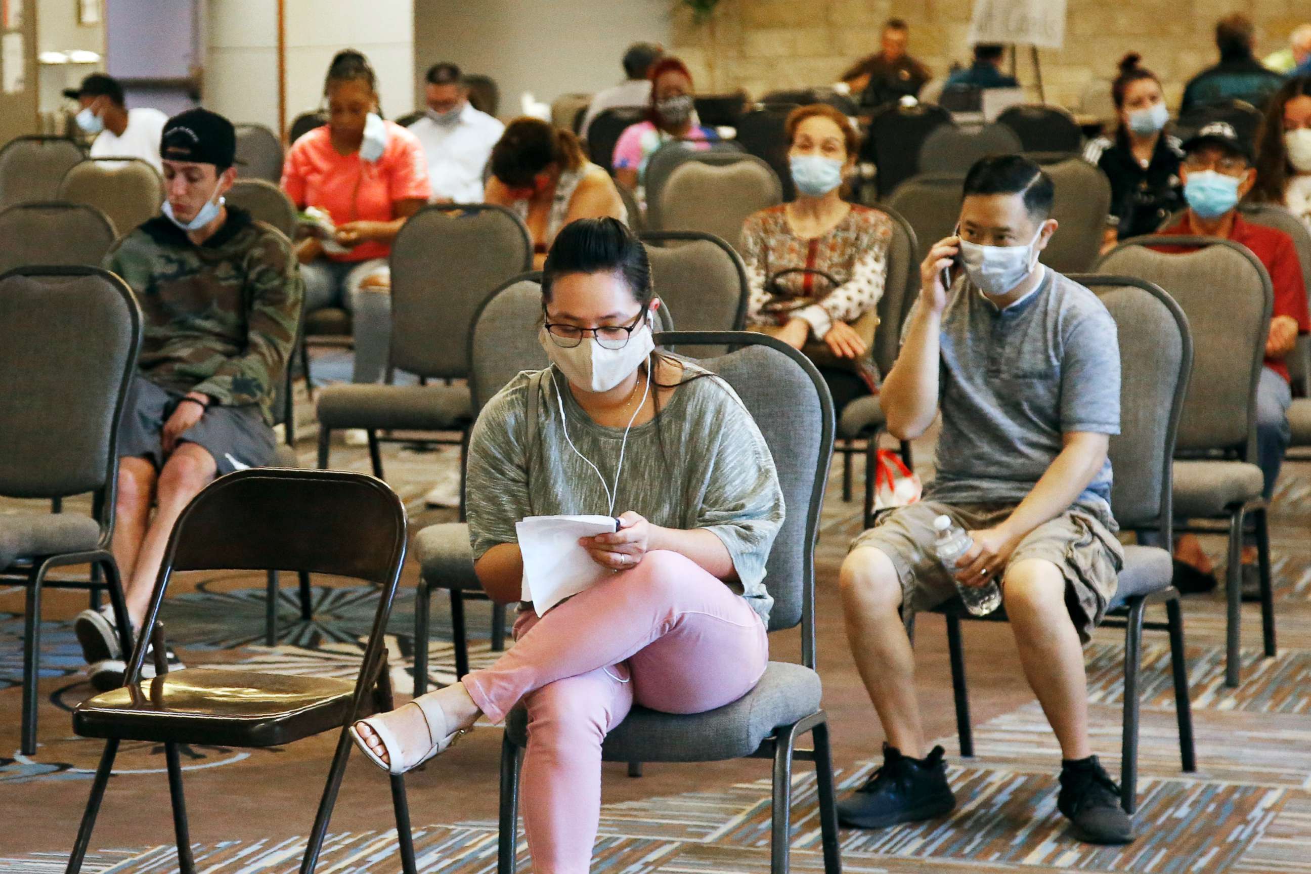 PHOTO: People wait to speak with representatives from the Oklahoma Employment Security Commission about unemployment claims, July 9, 2020, in Midwest City, Okla.