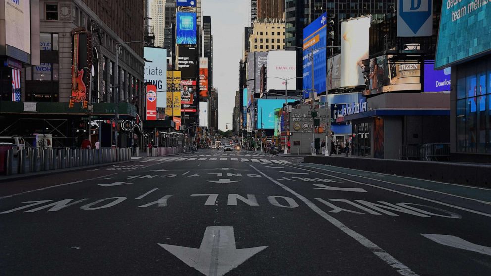 PHOTO: A car approaches on a nearly empty street near Times Square on May 27, 2020 in New York City.