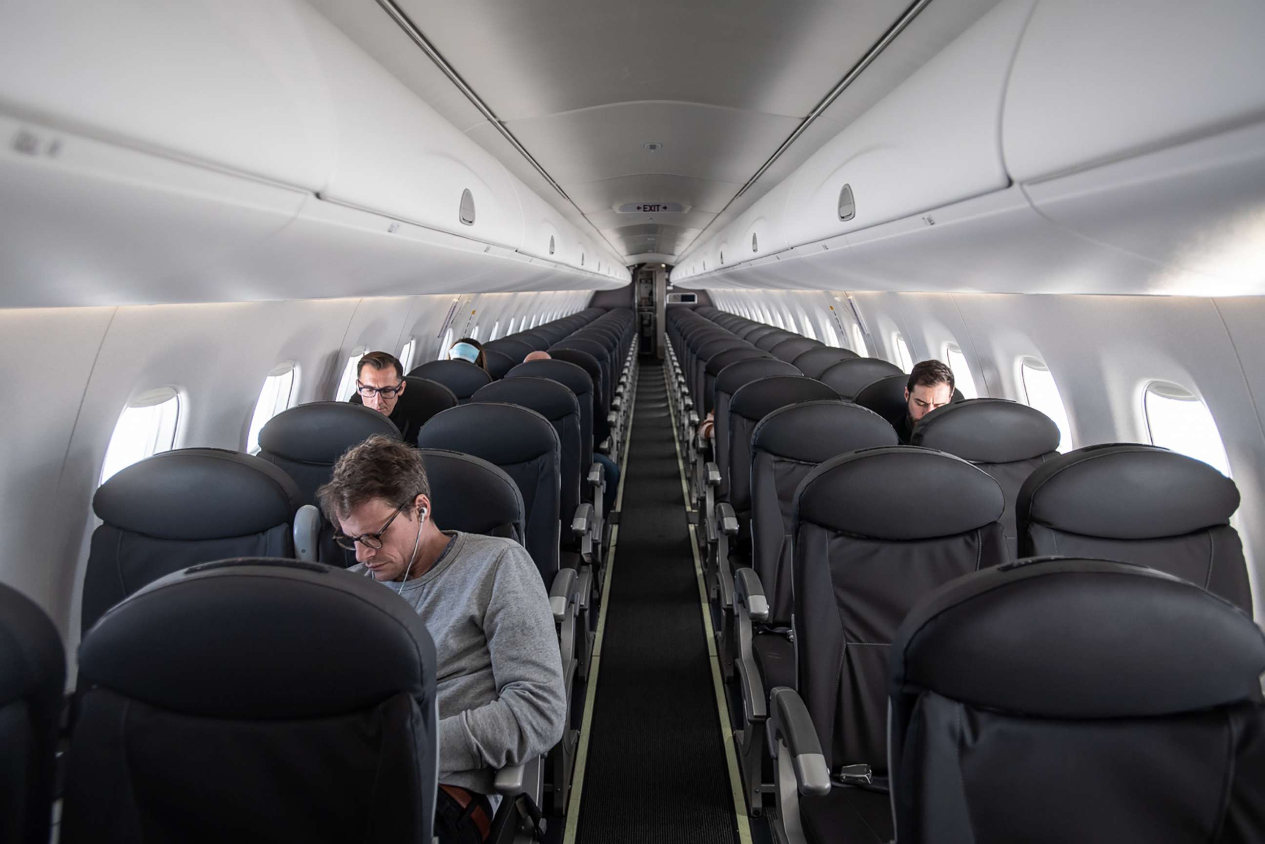 PHOTO: An almost empty British Airways passenger plane flies from Milan to London, March 5, 2020.