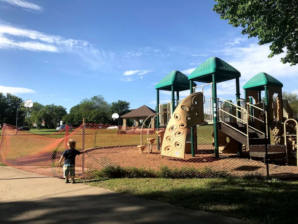 PHOTO: Kristine Tague's son walks past an empty playground. 