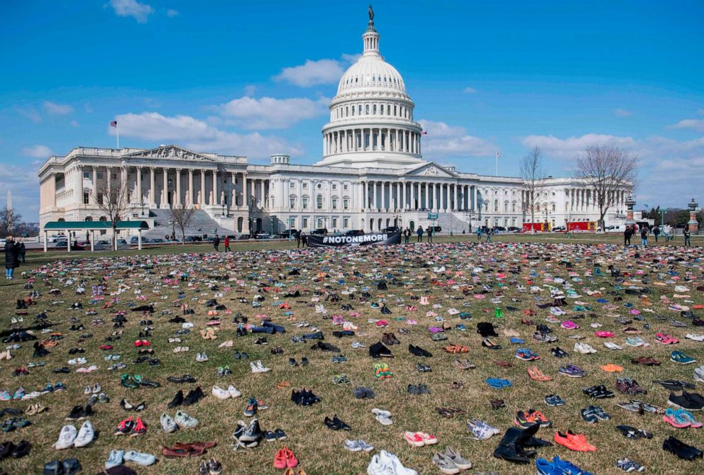 PHOTO: The lawn outside the U.S. Capitol is covered with 7,000 pairs of empty shoes to memorialize the 7,000 children killed by gun violence since the Sandy Hook school shooting.