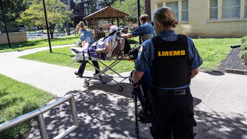 PHOTO: Louisville Metro EMS paramedics transport a woman suspected of experiencing a severe COVID-19 emergency, Sept. 6, 2021, in Louisville, Ky., during a surge in cases.