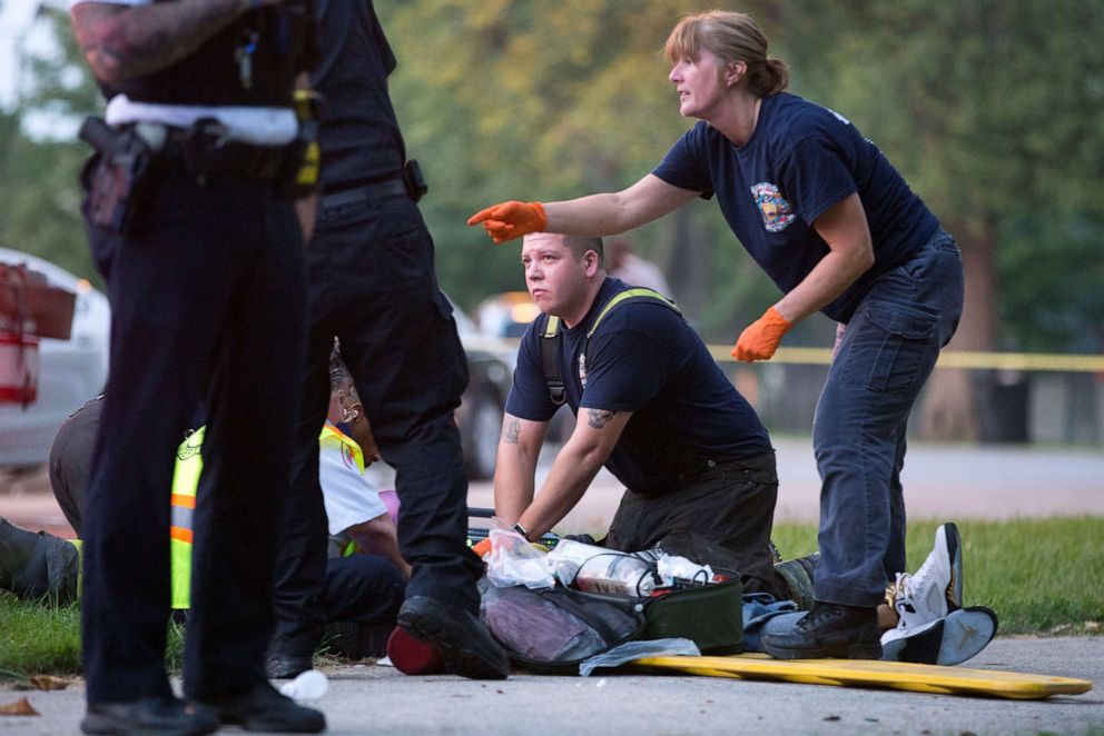 PHOTO: Members of the Chicago Fire Department work on a gunshot victim, Sept. 5, 2016, in Chicago.
