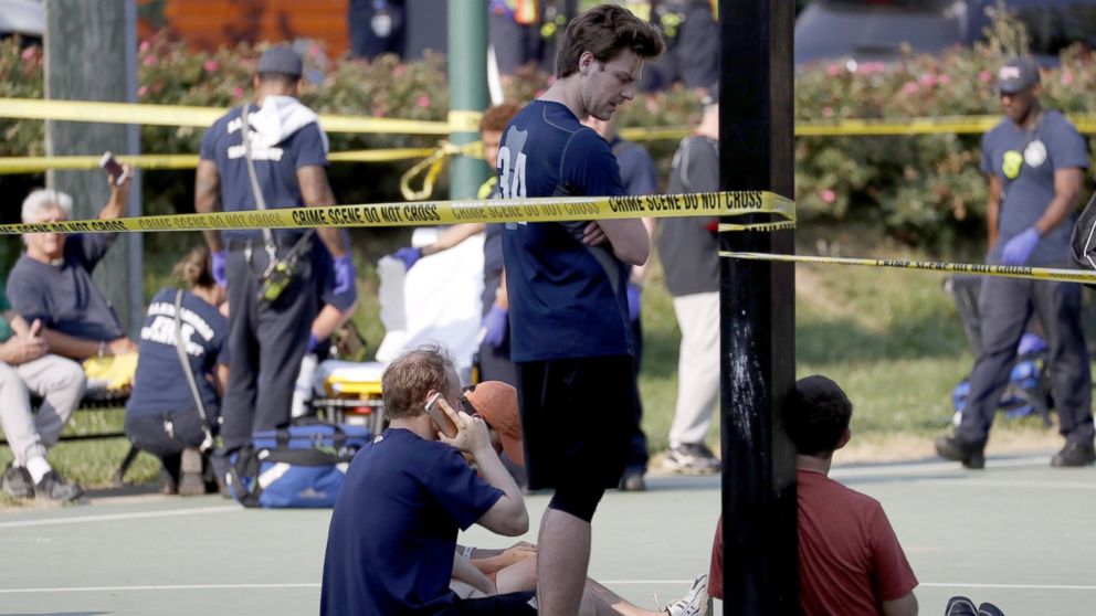 PHOTO: People gather near the scene of a shooting at the Republican Congressional baseball team  practice in Alexandria, Va, June 14, 2017. 
