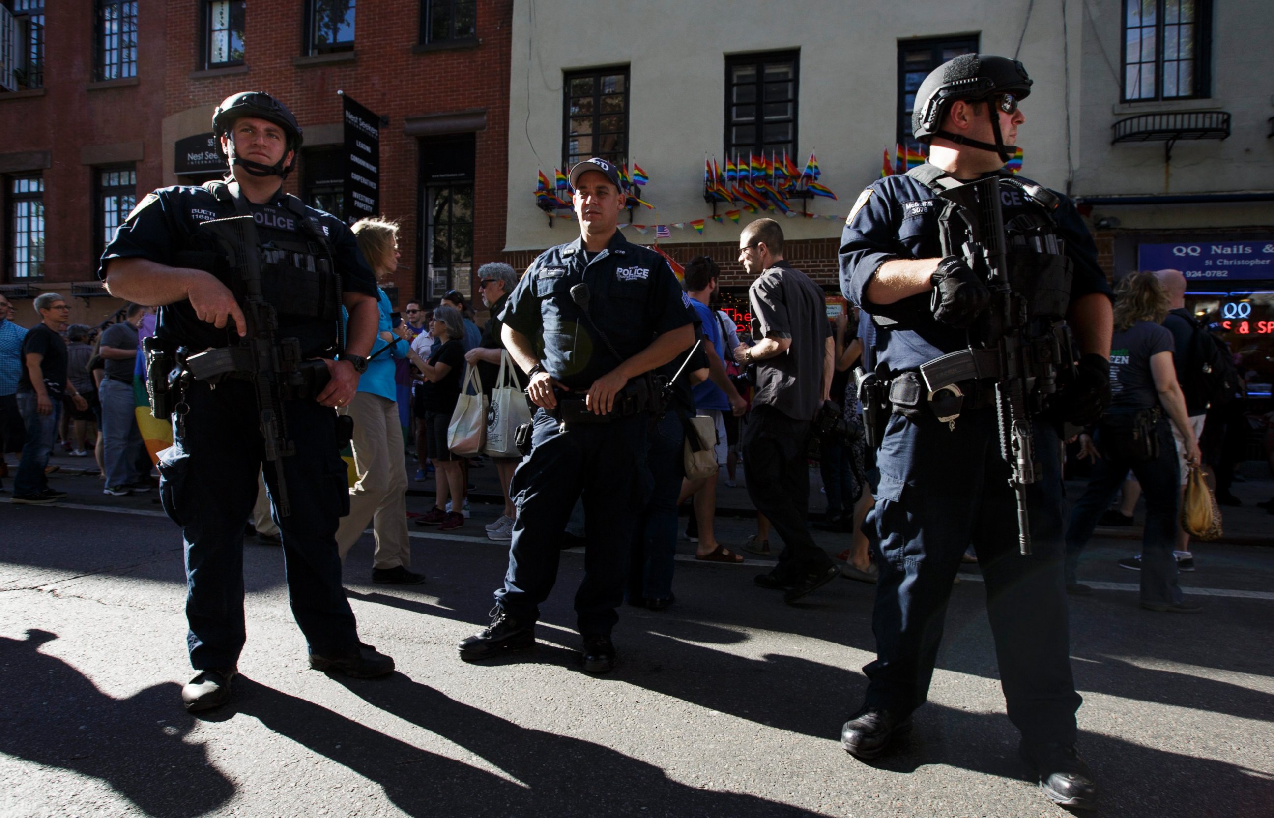 PHOTO: Members of the New York Police Department's Counter-terrorism Team stand guard as people gather for a vigil for the victims of a mass shooting at an Orlando, Florida gay club outside of the Stonewall Inn in New York, June 12, 2016.