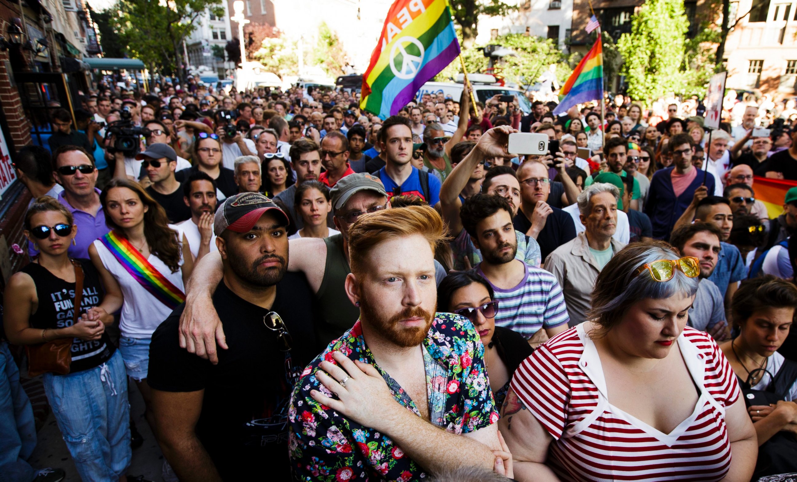 PHOTO: People gather for a vigil outside the Stonewall Inn in New York for the victims of a mass shooting at an Orlando, Florida gay club, June 12, 2016.