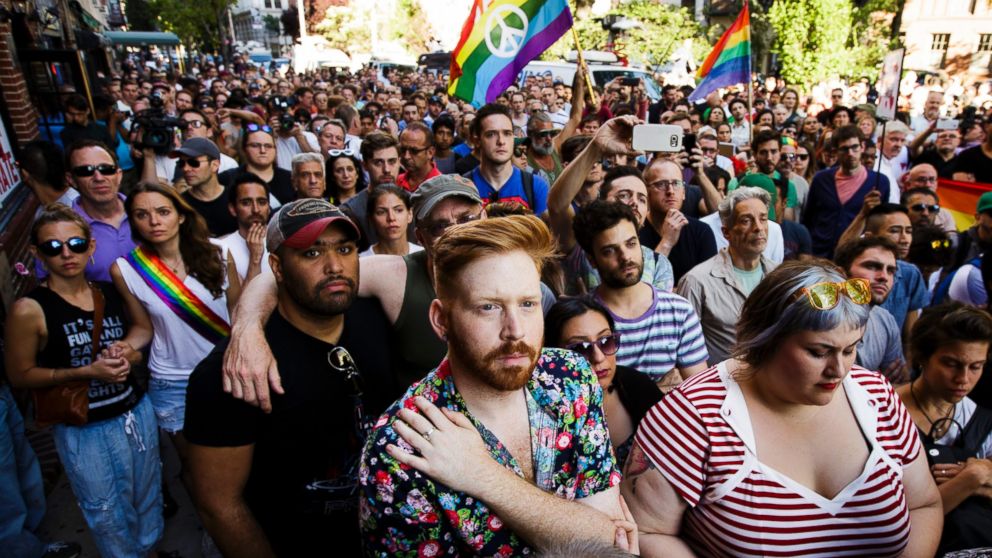 PHOTO: People gather for a vigil outside the Stonewall Inn in New York for the victims of a mass shooting at an Orlando, Florida gay club, June 12, 2016.
