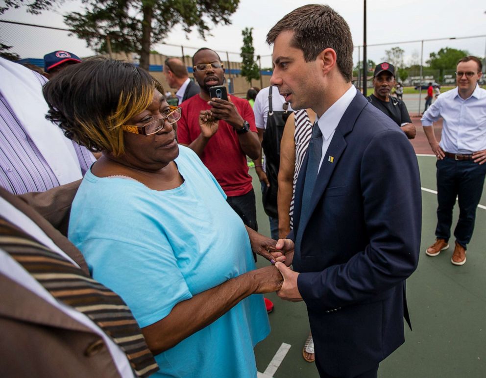 PHOTO: South Bend Mayor and Democratic presidential candidate Pete Buttigieg shares a moment with Shirley Newbill, mother of Eric Logan, during a gun violence memorial at the Martin Luther King Jr. Recreation Center in South Bend, Ind.