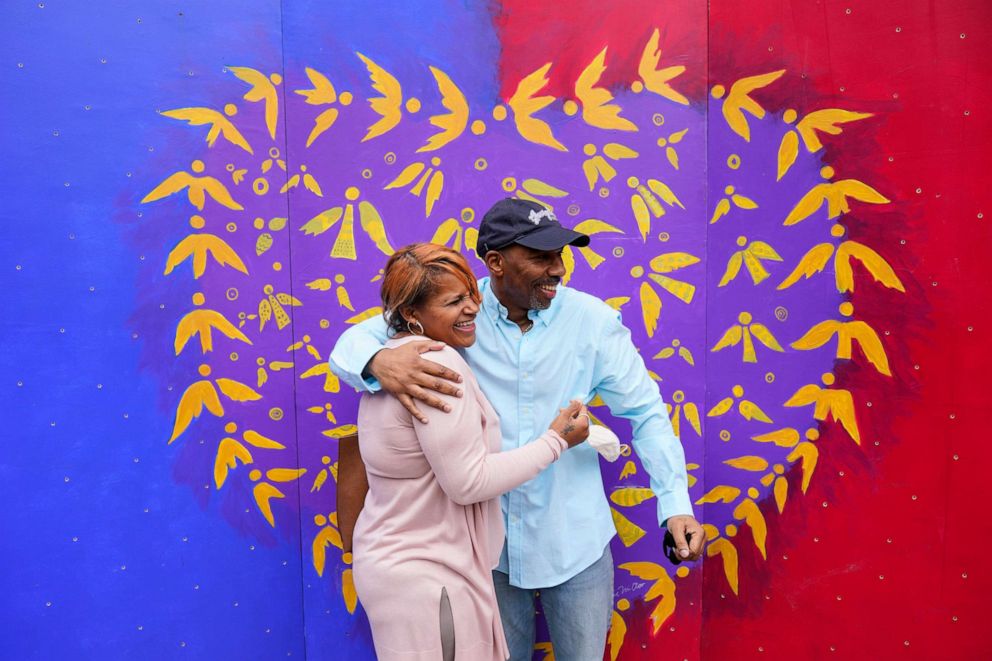 PHOTO: Eric Riddick, and his wife Dana Baker-Riddick laugh as they pose for photographs during a news conference in Philadelphia, Friday, May 28, 2021. Eric Riddick was released Friday after spending nearly three decades in prison.