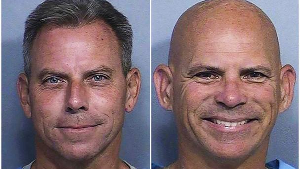 This combination of two booking photos provided by the California Department of Corrections shows Erik Menendez, left, and Lyle Menendez.