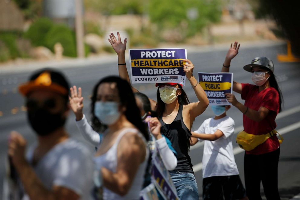 PHOTO: Healthcare workers protest what they say are unsafe working conditions and demand OSHA to intervene outside of MountainView hospital, April 30, 2020, in Las Vegas.