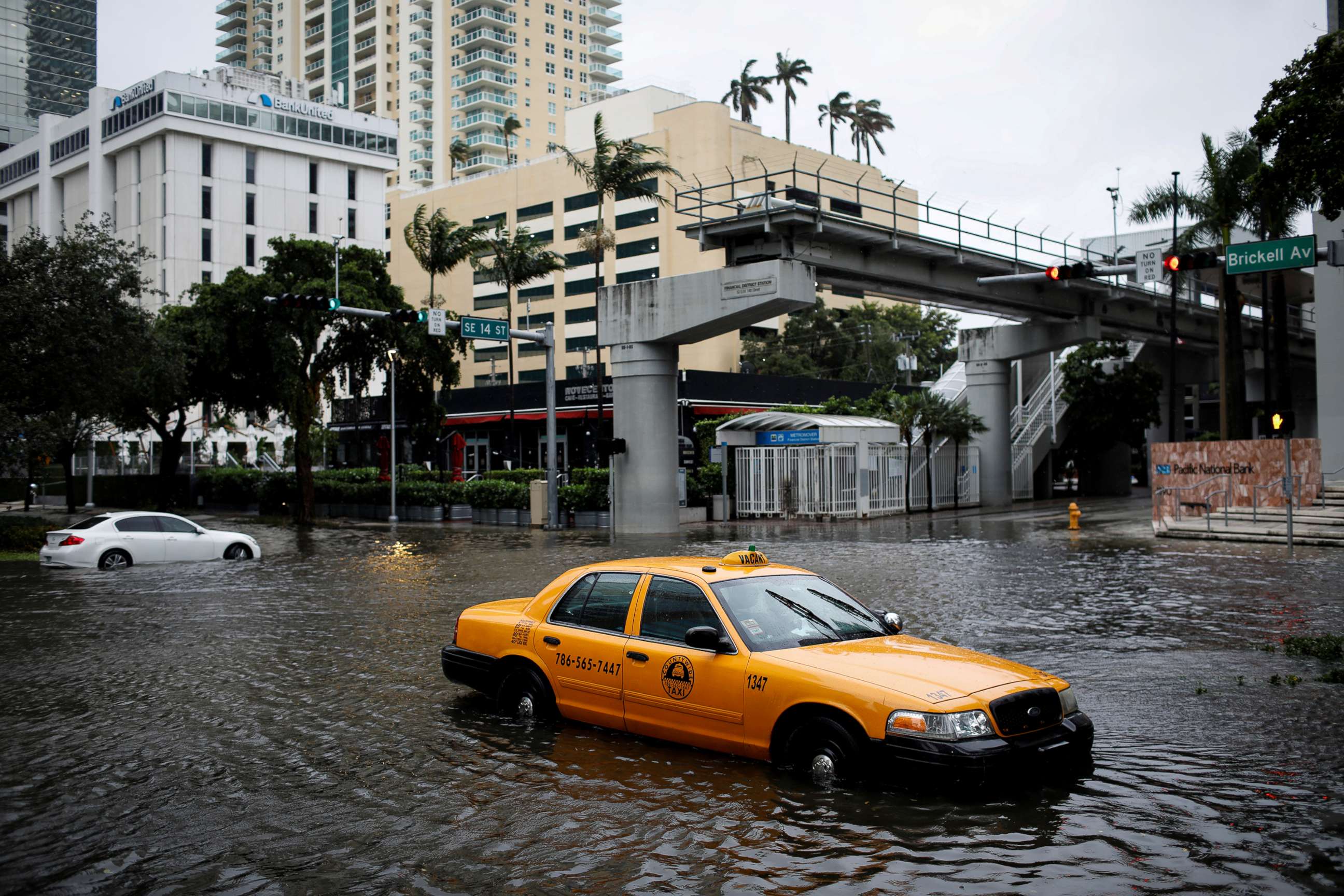 PHOTO: A damaged taxi is seen in floodwaters caused by Storm Eta in a street at the Brickell neighborhood in Miami, Nov. 9, 2020.