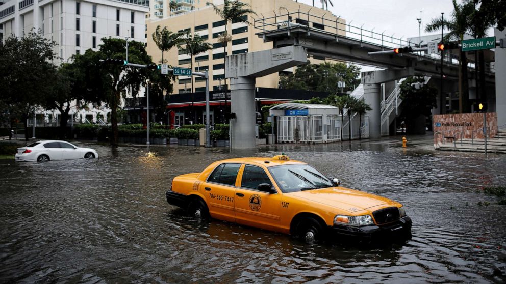 PHOTO: A damaged taxi is seen in floodwaters caused by Storm Eta in a street at the Brickell neighborhood in Miami, Nov. 9, 2020.